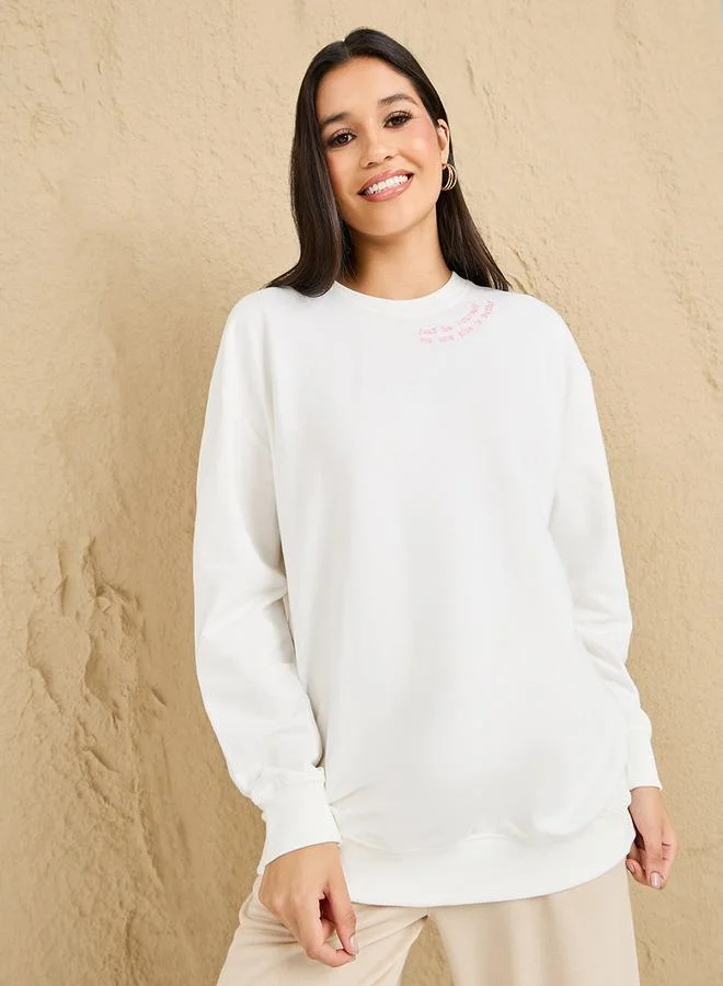 Styli Regular Fit Longline Slogan Embroidered Sweatshirt