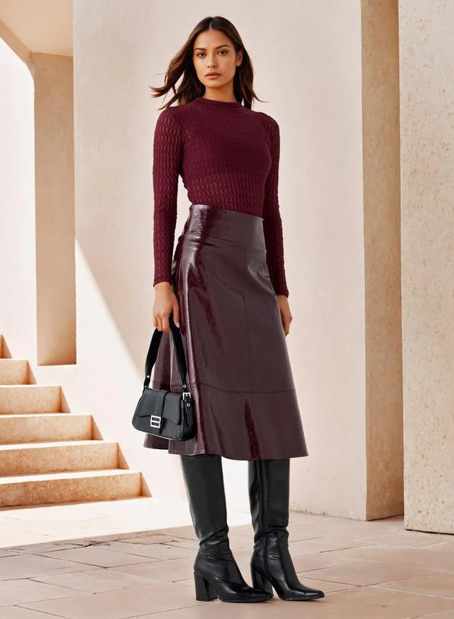 ايكونيك تنورة ميدي أيقونية بتصميم - وملمس مميز