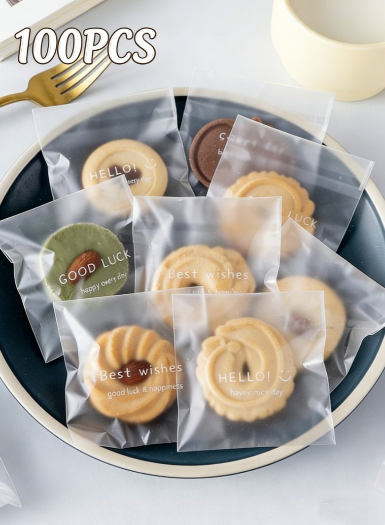 صحة هوم عبوة 100 كيس تغليف بسكويت وحلوى ذاتي الإغلاق سميك بدرجة آمنة غذائياً، أكياس شفافة نصف مطفية بنقوش إنجليزية لطيفة لتغليف الحلويات والكوكيز 7.5×7.5+3 سم - Image 1