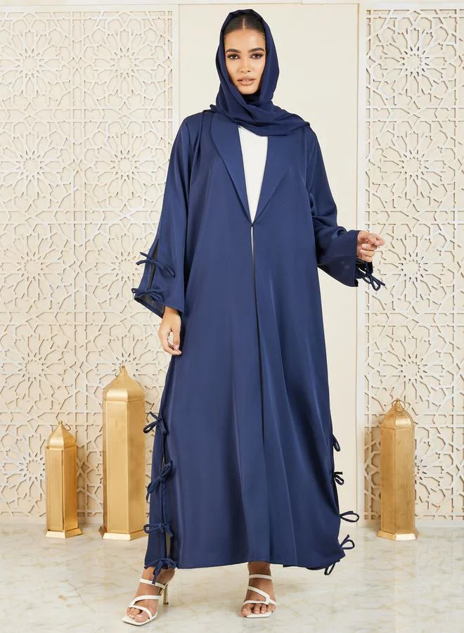 موديستي عباية مزينة بربطات معقودة مع زر غلق