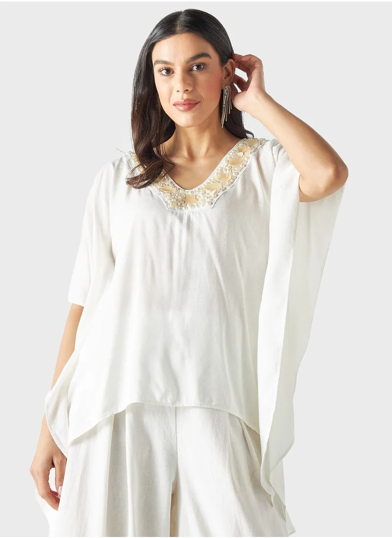 ايكونيك Embellished Cape Sleeve Top