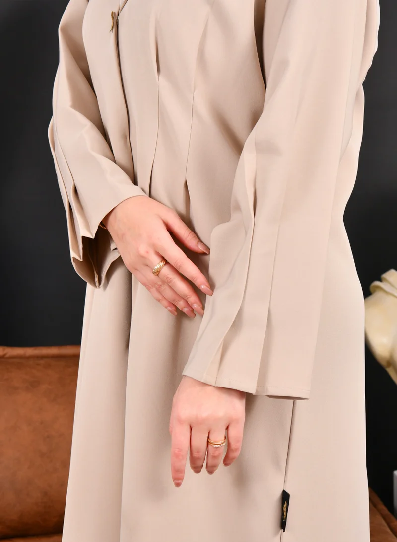 HAWRAA ABAYA Beige formal blazer abaya with pleats at the back and buttoned sleeves