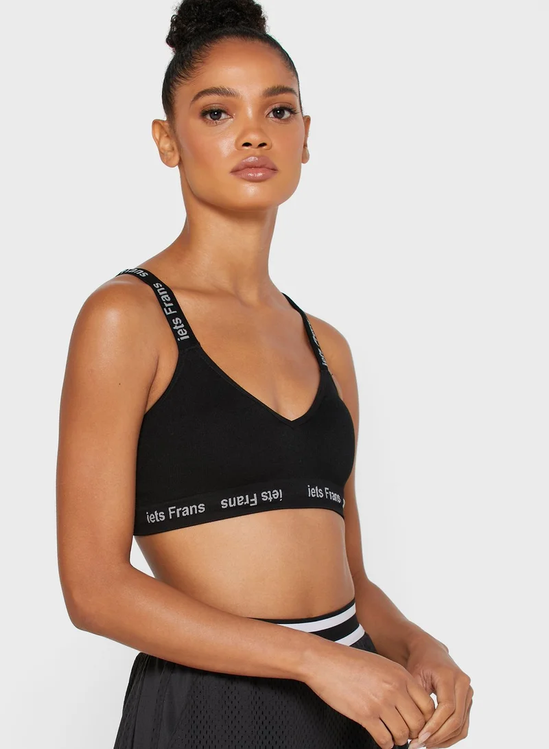 URBAN OUTFITTERS Slogan Band Sports Bra