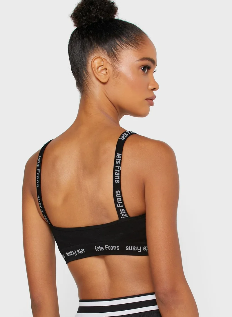 URBAN OUTFITTERS Slogan Band Sports Bra