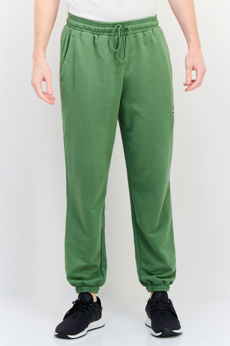 Puma x Santa Cruz Men Sportswear Fit Outdoor Sweatpants, green - Image 1