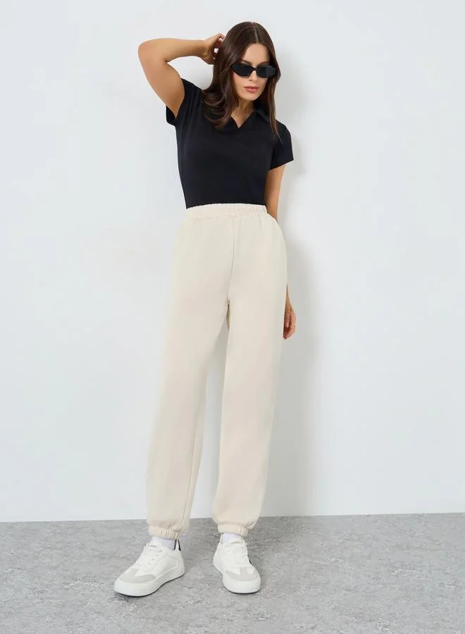 Beige Solid Elastic Waist Cuffed Joggers