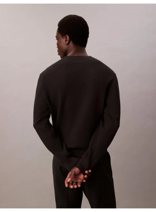 كالفن كلاين كنزة بياقة دائرية وأكمام طويلة بنقشة