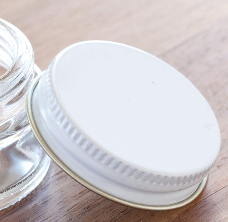 JUVITUS 1 oz / 30 ml Clear Thick Glass Straight Sided Jar with White Metal Airtight Lid (12 Pack) - Image 4