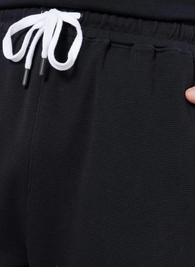 Styli  Men Black Waffle Oversize Joggers for Men | Best Price UAE