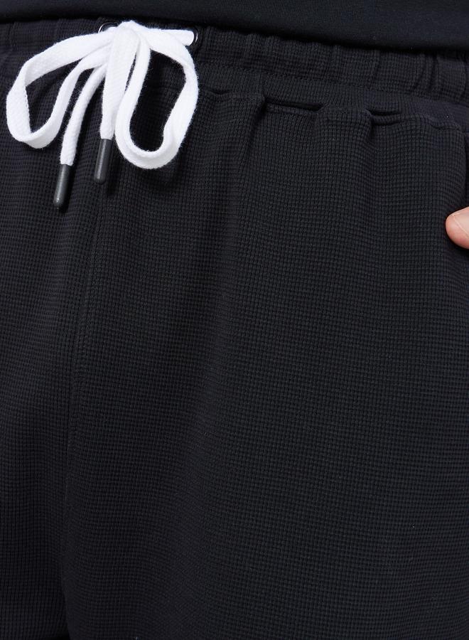 ستايلي بنطال جوغر بقصة واسعة وقماش وافل - Image 3