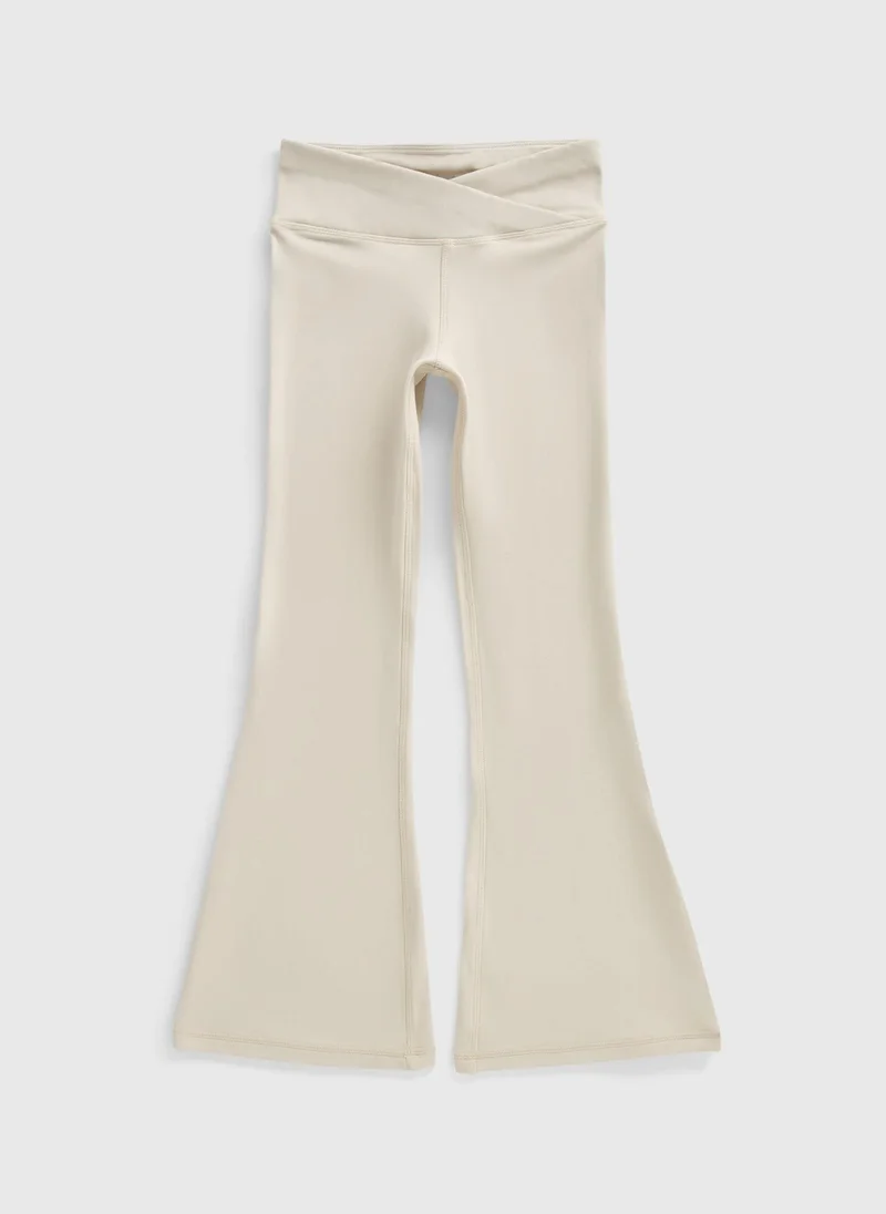 Matalan Girls Cream Cross Waist Flared Trousers
