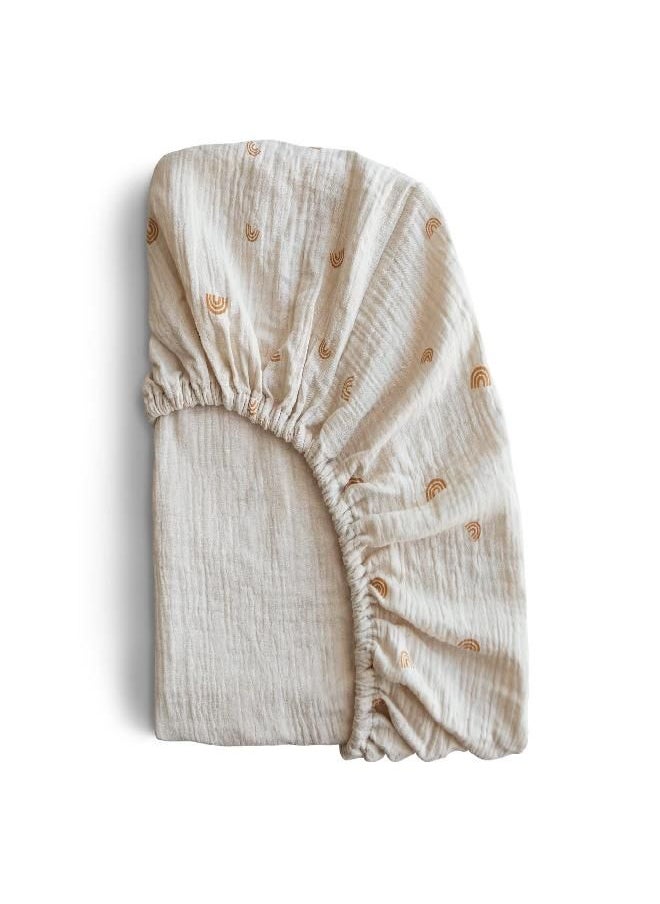 mushie - mushie Extra Soft Muslin Fitted Mini Crib Sheet | 24"x 38" (Rainbows) - Image 1