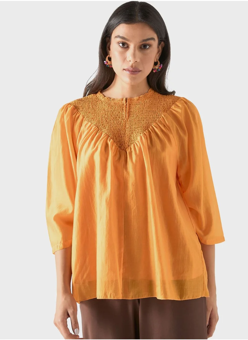 ايكونيك Ruched Flared Sleeve Top