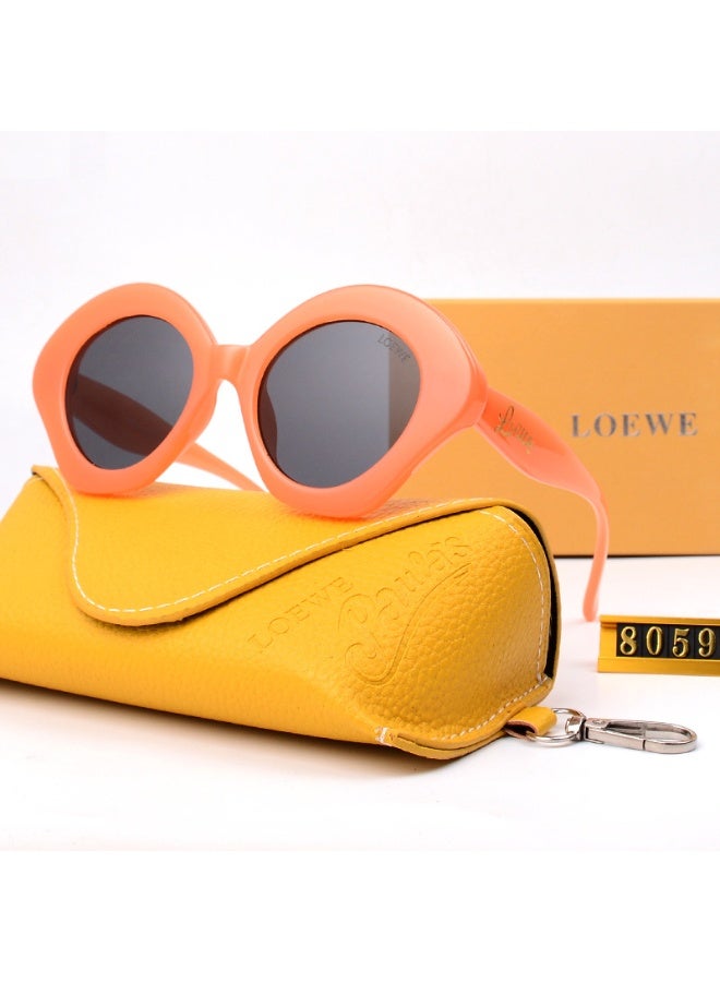 LOEWE نظارات شمسية دائرية برتقالية من لوي في مع عدسات داكنة وحافظة تحمل العلامة التجارية