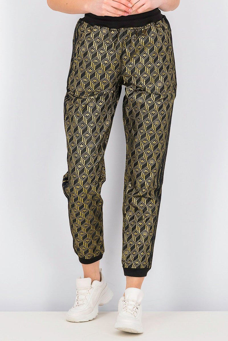 Adidas سروال رياضي نسائي متميز من SST، أسود وذهبي معدني - Image 1