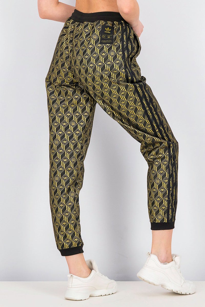Adidas سروال رياضي نسائي متميز من SST، أسود وذهبي معدني - Image 4