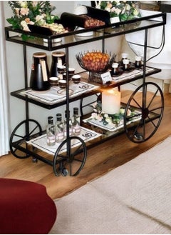 Black Cycle Serving Trolley with 3 Tiers, featuring a modern design and clear glass for perfect display. It can be easily used in kitchens, restaurants, hotels, chalets and homes, making it a distinctive and valuable addition to any occasion, (90 cm length, 90 cm height, 38 cm width)