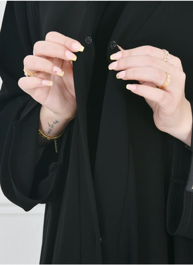 HAWRAA ABAYA Black cloche abaya with snap closure