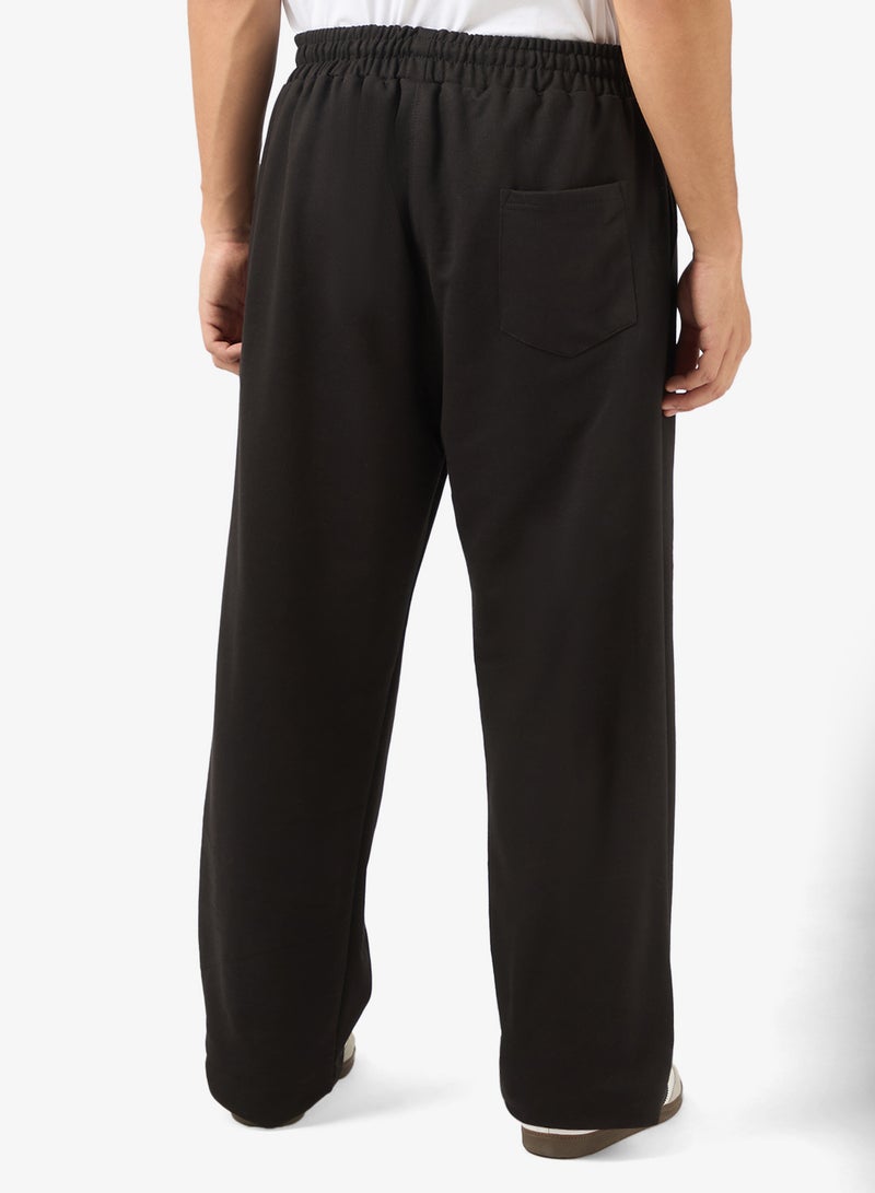 سفنتي فايف بيسيكس بنطلون رياضي بطبعات جرافيك وحافة مفتوحة - Image 3