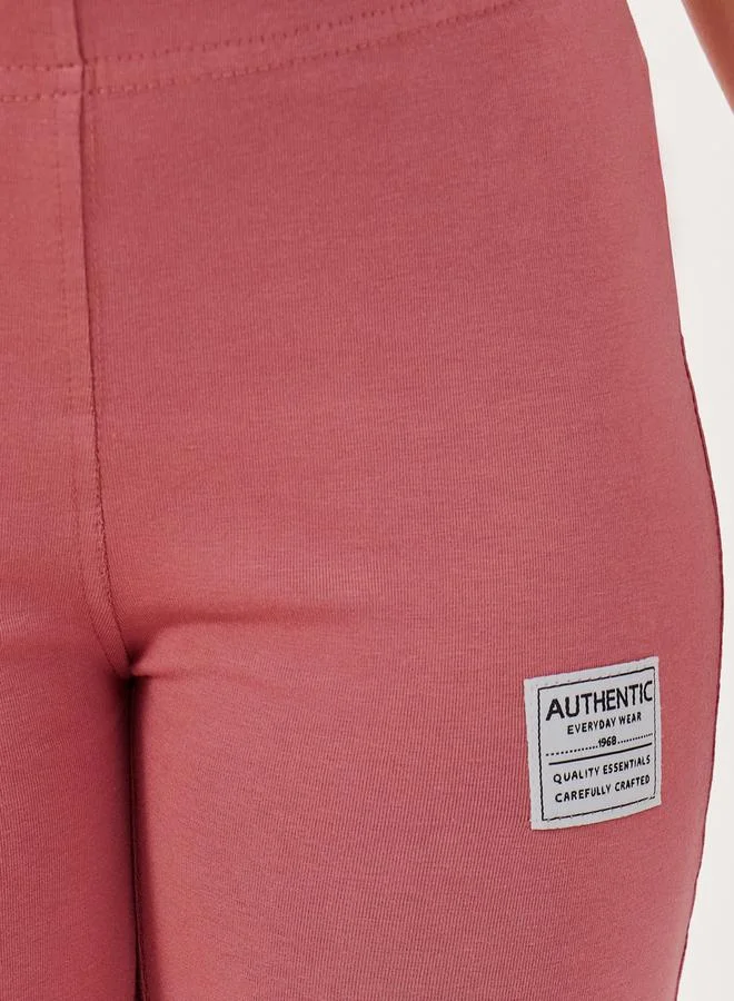 Styli High Rise Flared Legging with Badge