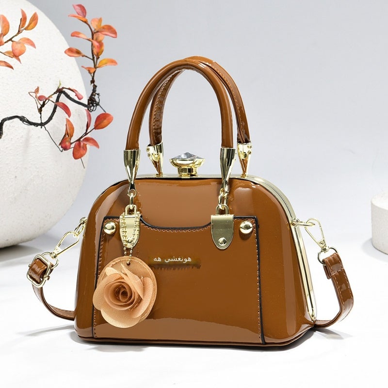 Steel armor mini shell bag, suitable for casual fashion, shiny surface, equipped with floral charm pendant, multi-functional handbag or cross-body bag, fashionable classic, lightweight and durable design