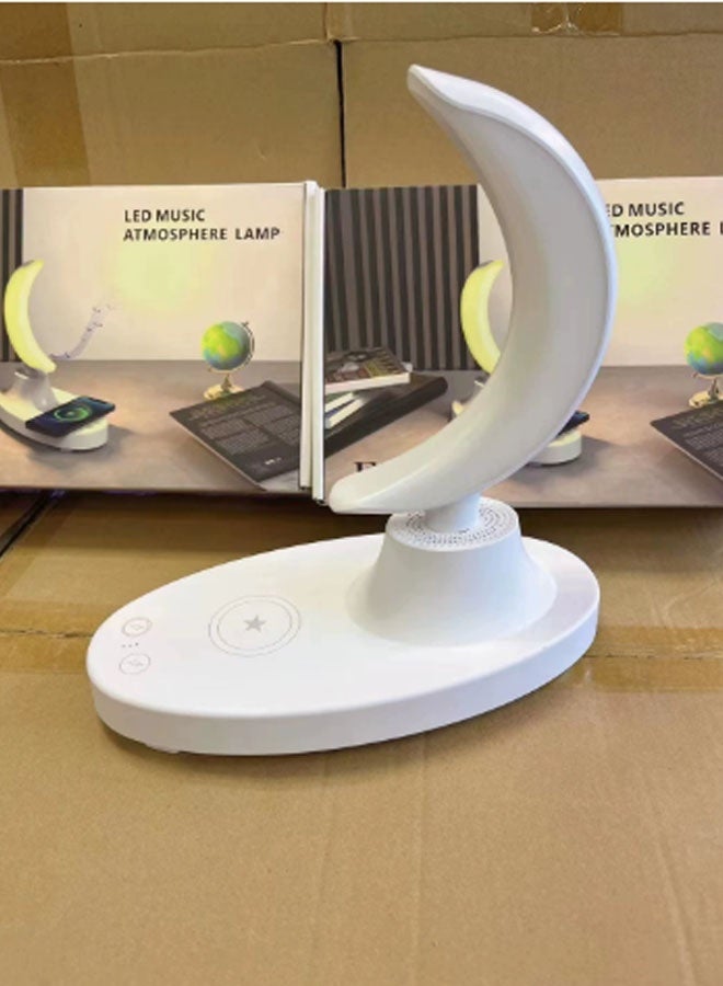 نيوترل مكبر صوت Bluetooth F21 New Creative Moon Lamp يعمل كإضاءة ليلية ونظام صوتي مع شاحن للهاتف المحمول، ويجمع بين تشغيل الموسيقى والتحكم الصوتي الذكي والإضاءة المحيطة مع شحن الهاتف المدمج. يتميز بتصميم مبتكر مناسب لغرف المعيشة والمكاتب وغرف النوم وغيرها. (أبيض) - Image 2