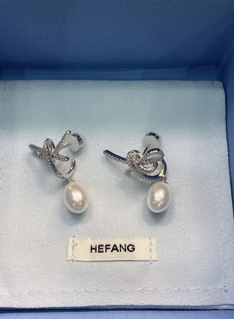 HEFANG Light Luxury Personalized White Moonlight Ribbon Earrings  - Image 1