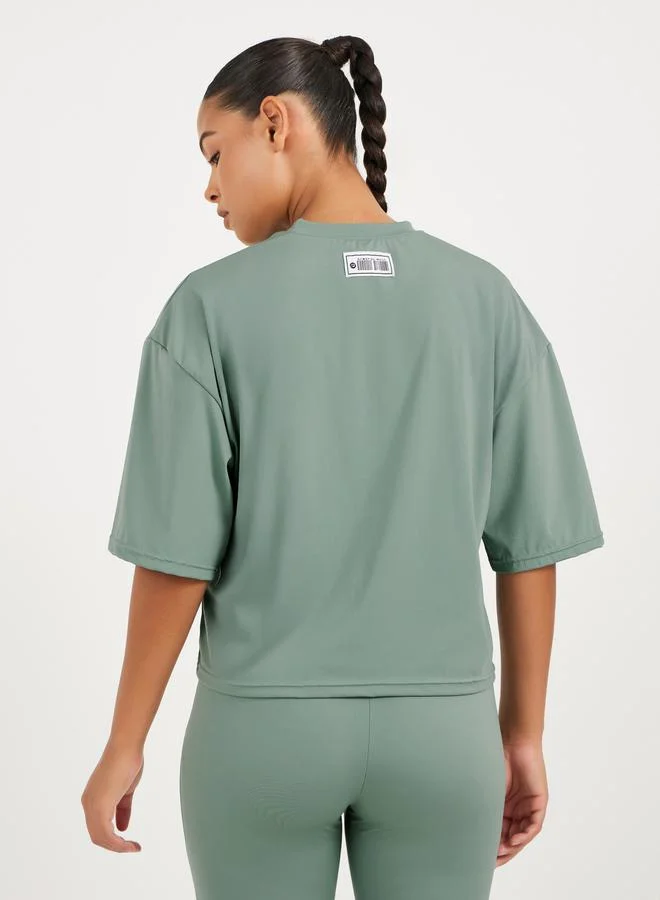 Styli Gymspire Edition - Label Striped and Text Print Boxy Short Sleeve Top