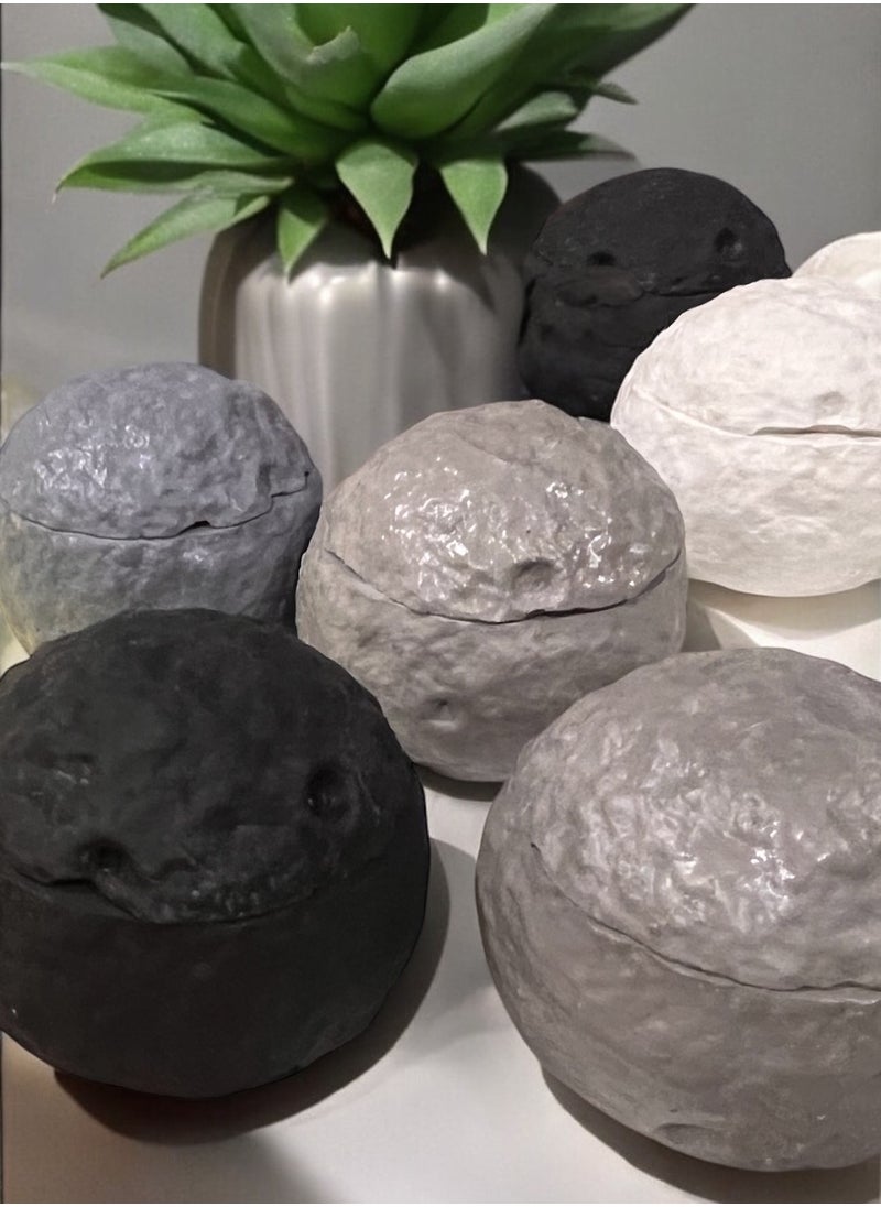 Moon Candle: A scented candle in the shape of the moon in white with a beautiful phrase written on it: “You wish for a star, and your Lord wishes to give you the moon (scent: peach)” 250 grams