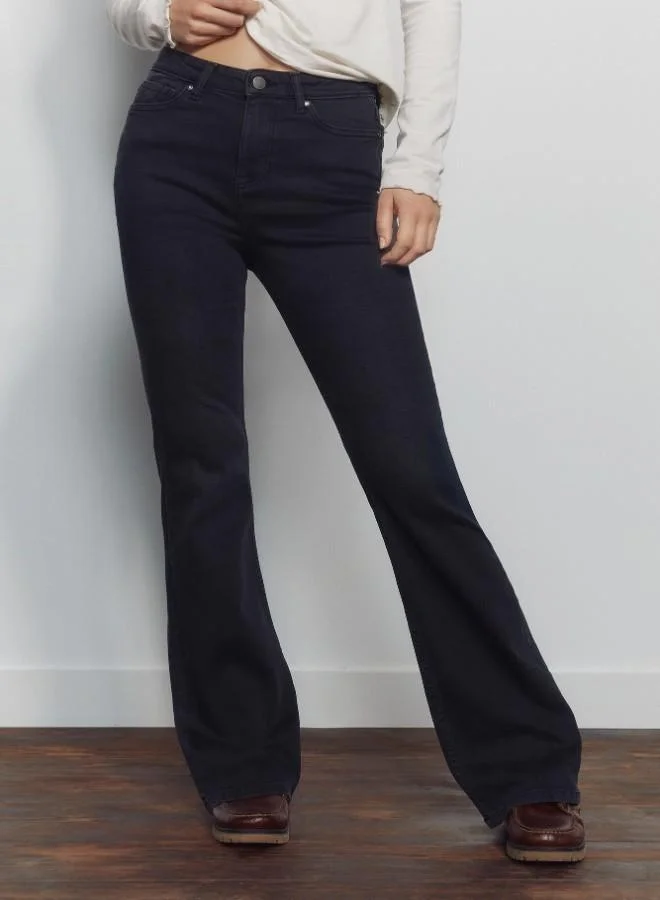 Springfield  High-waisted jeans with front and back pockets, button and zip fastening fastening , and a slim fit with a flared hem . These jeans feature a state-of-the-art washing process that reduces water, chemical, and energy consumption. for Women | Best Price UAE