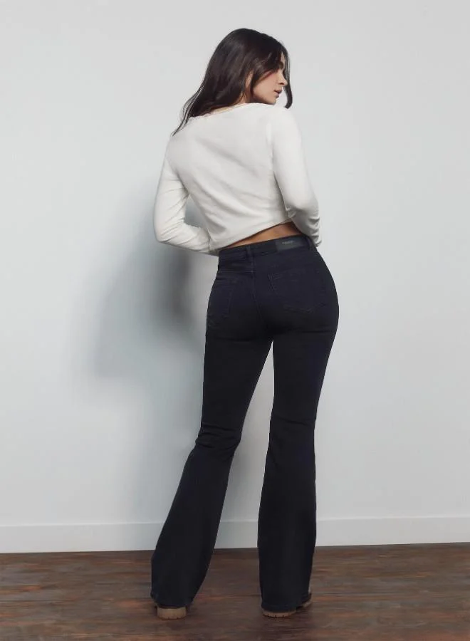 Springfield  High-waisted jeans with front and back pockets, button and zip fastening fastening , and a slim fit with a flared hem . These jeans feature a state-of-the-art washing process that reduces water, chemical, and energy consumption. for Women | Best Price UAE