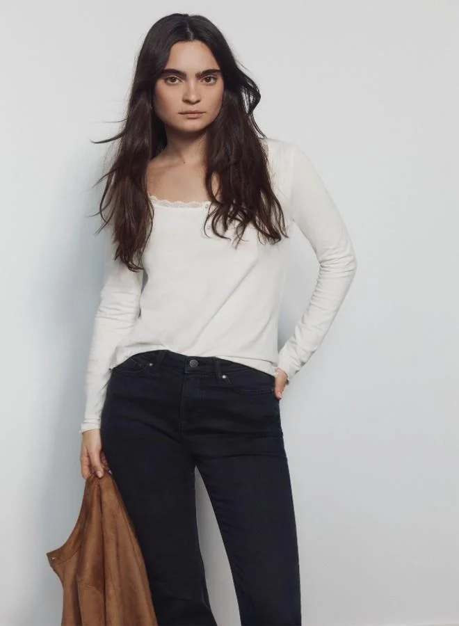 Springfield  High-waisted jeans with front and back pockets, button and zip fastening fastening , and a slim fit with a flared hem . These jeans feature a state-of-the-art washing process that reduces water, chemical, and energy consumption. for Women | Best Price UAE