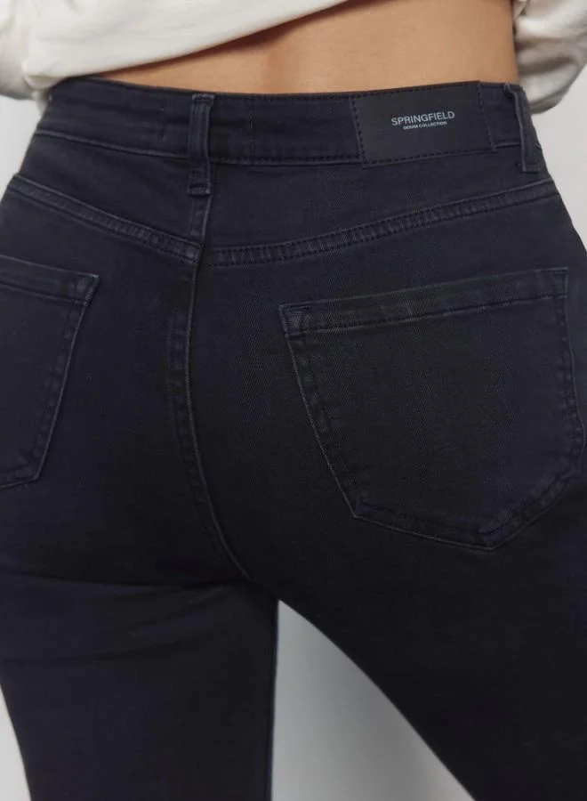 Springfield  High-waisted jeans with front and back pockets, button and zip fastening fastening , and a slim fit with a flared hem . These jeans feature a state-of-the-art washing process that reduces water, chemical, and energy consumption. for Women | Best Price UAE