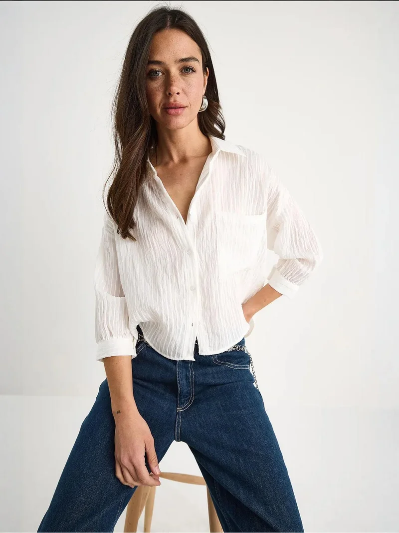 بيانكو لوتشي قميص قصير مخطط بنقوش لوكسي بأزرار وجيب