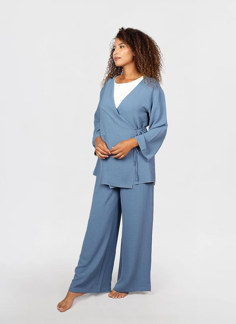 جيمي لي بوند Modest 2 pc Set of wrap-style long-sleeve top with a side tie detail, paired with wide-leg pants