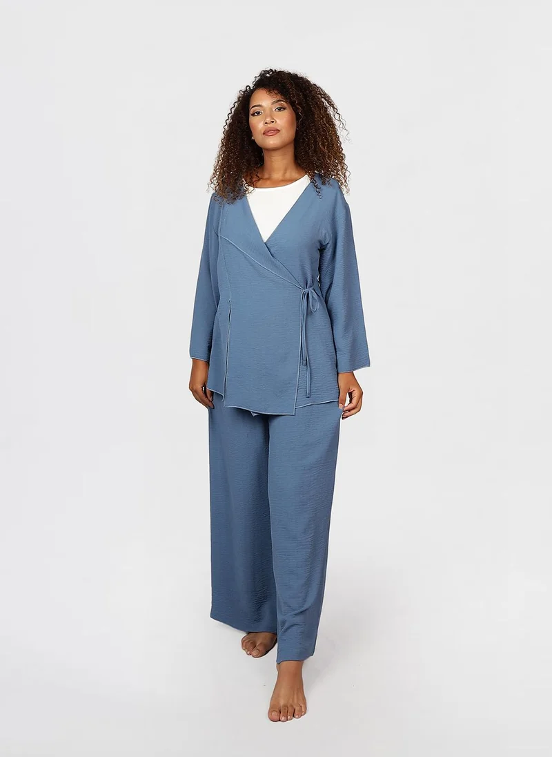 جيمي لي بوند Modest 2 pc Set of wrap-style long-sleeve top with a side tie detail, paired with wide-leg pants