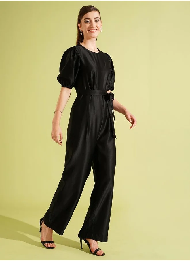 جلو باص Globus Women Black Satin Round Neck Puff Sleeve Waist Tie-Up Long Party Jumpsuit by Styli