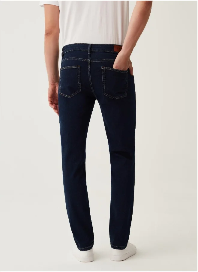 او في اس Slim-fit cross-hatch cotton jeans