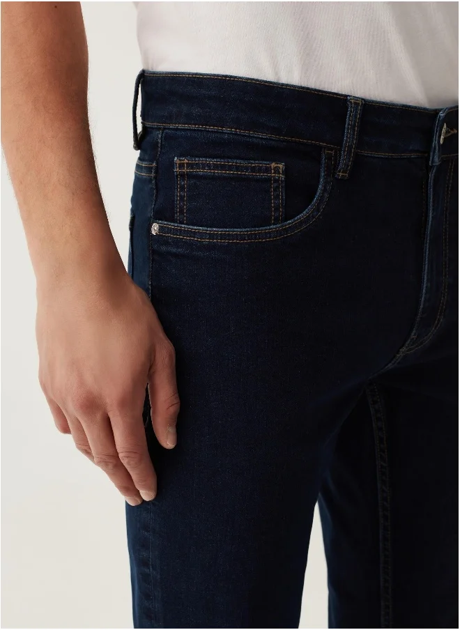 او في اس Slim-fit cross-hatch cotton jeans