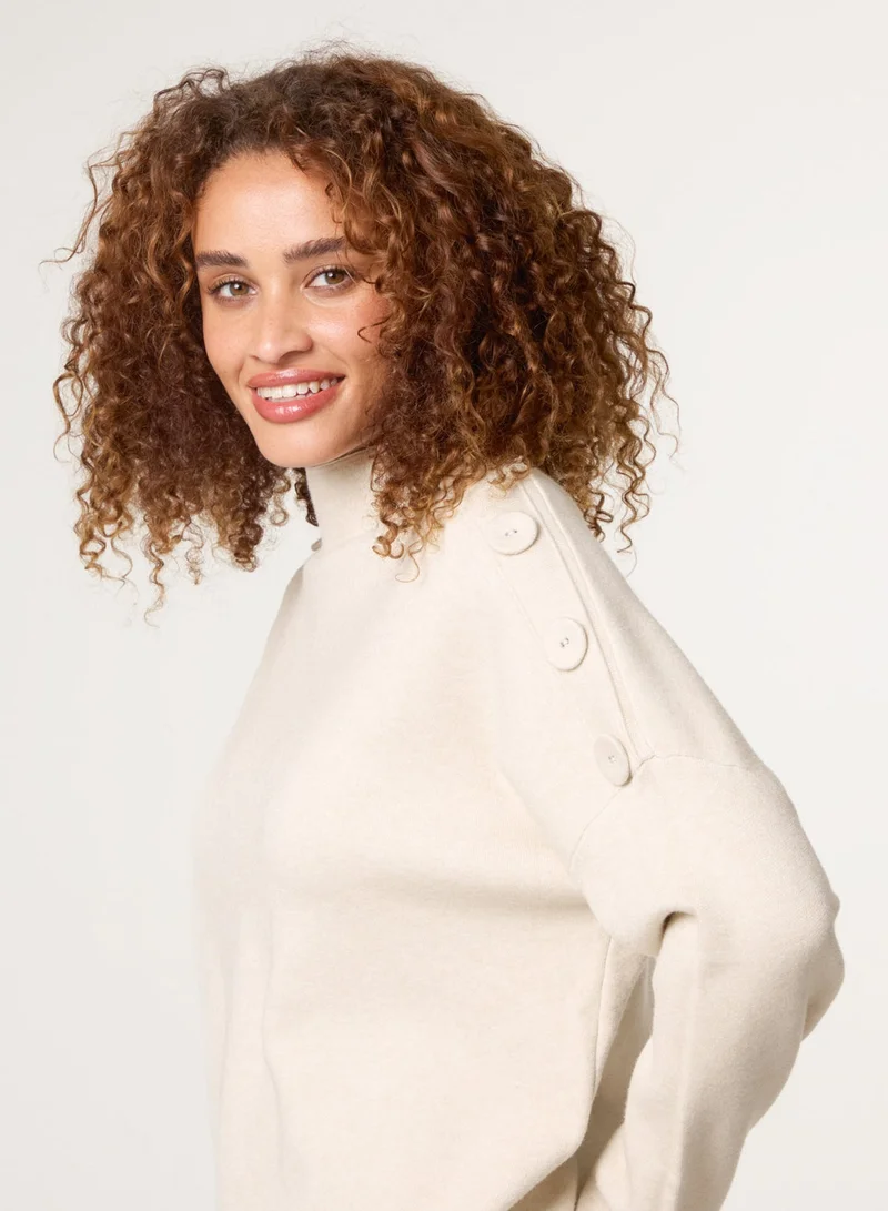 بلو فانيلا كنزة بكتف بأزرار