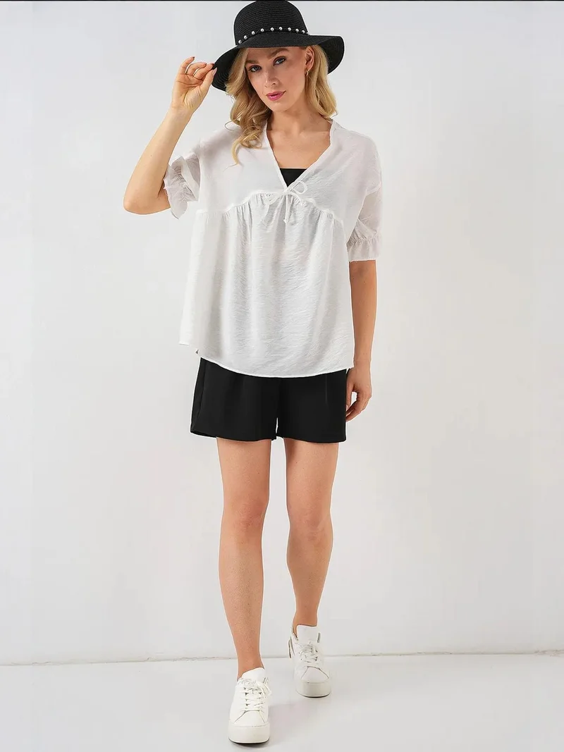 بيغ دارت بلوزة بياقة على شكل حرف  بنقوش مع فيونكة