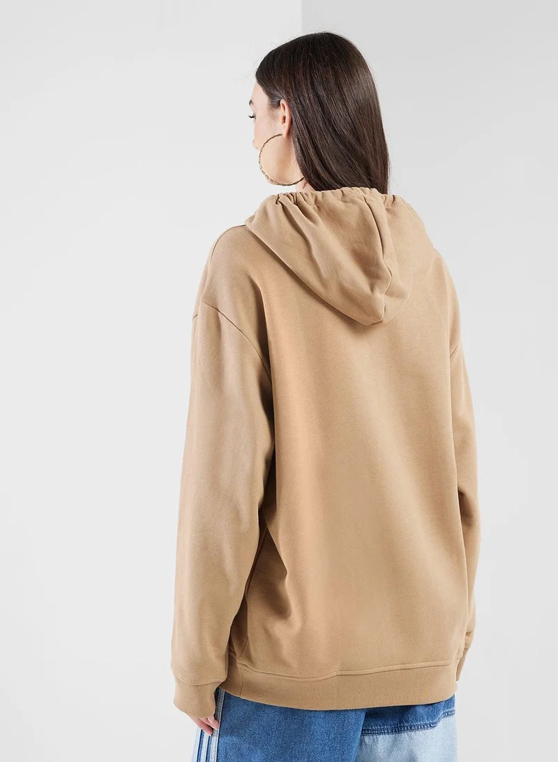 Adidas Originals cardboard Essentials Loose French Terry Hoodie for Women | Best Price UAE
