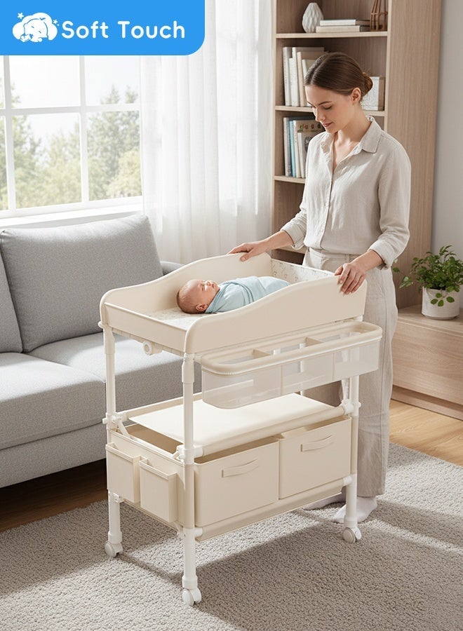 سوفت تاتش طاولة تغيير حفاضات الأطفال القابلة للطي مع عجلات، منظم لغرفة الأطفال حديثي الولادة، طاولة تغيير ملابس مع رف تخزين، هيكل معزز وارتفاع قابل للتعديل (بيج) - Image 1