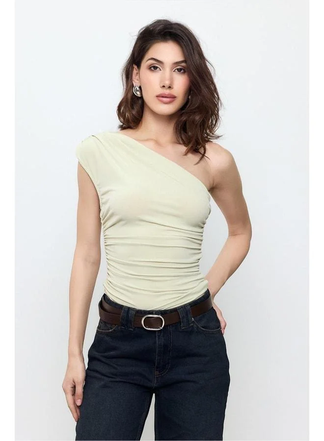 Sherin Green One-Shoulder Blouse.