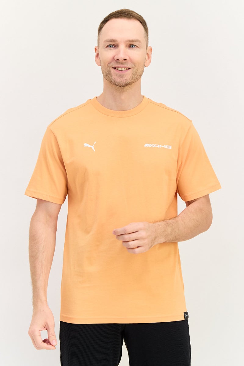 PUMA Men Sportswear Fit Short Sleeve Outdoor T-Shirt, Light Orange - Image 1