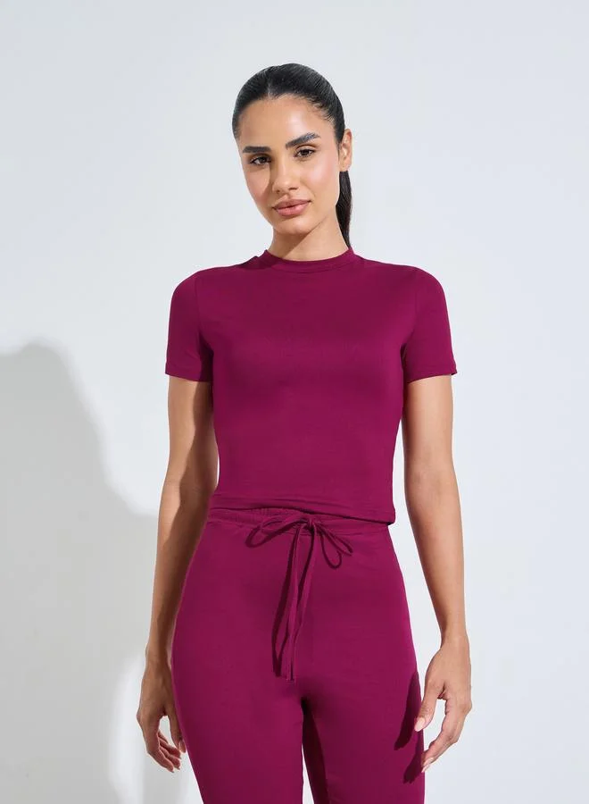 Styli Active  Burgundy Solid Fitted T-Shirt And Flared Pants Active Set for Women | Best Price UAE