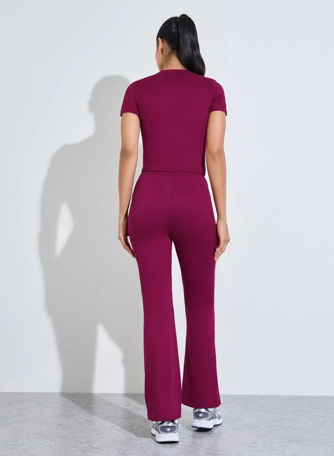 Styli Active  Burgundy Solid Fitted T-Shirt And Flared Pants Active Set for Women | Best Price UAE