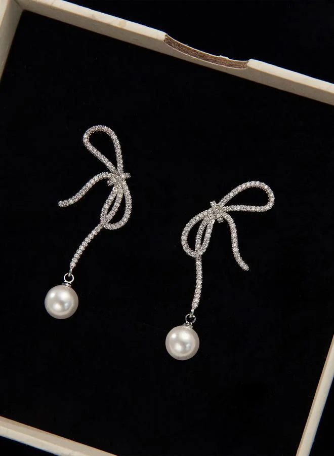 تايك تو أقراط لؤلؤ صناعي مزينة بفيونكة