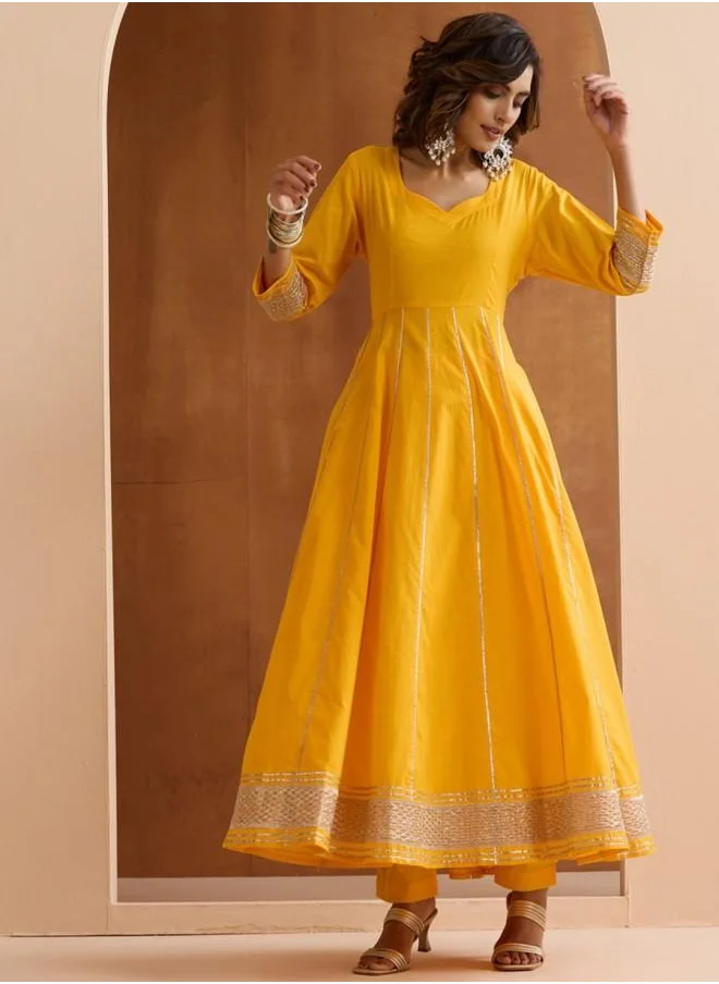 ISHIN Yellow Women Yellow Cotton Kurta Set with Embroidered pattern Tunic and Palazzo features a Round neckline and Three-Fourth Sleeve secured with Elastic closure and styled in Straight Fit ideal for Festive moments — designed to make heads turn.