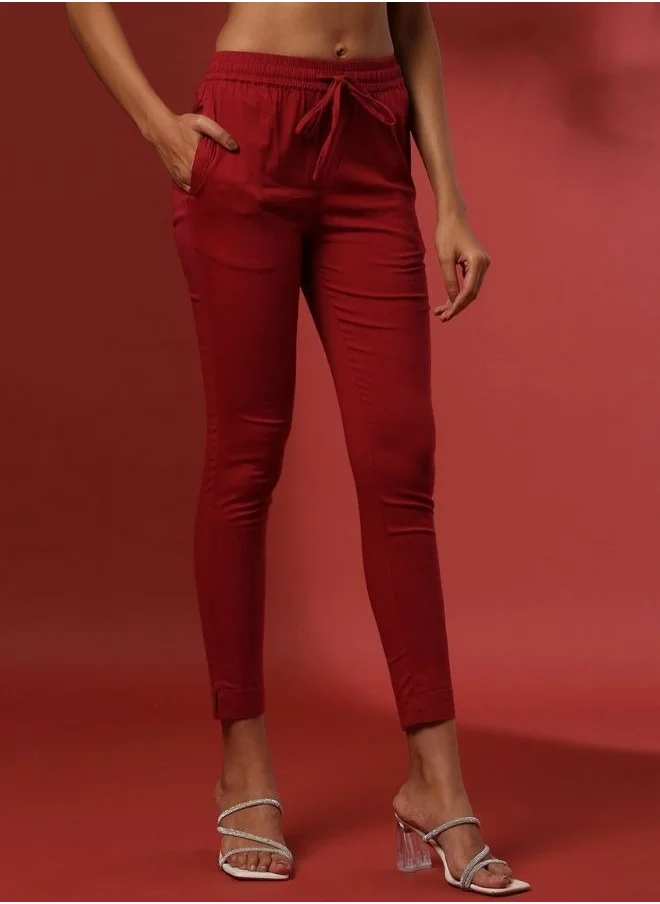 Abhishti Fitted narrow  stretch pants with slits- red